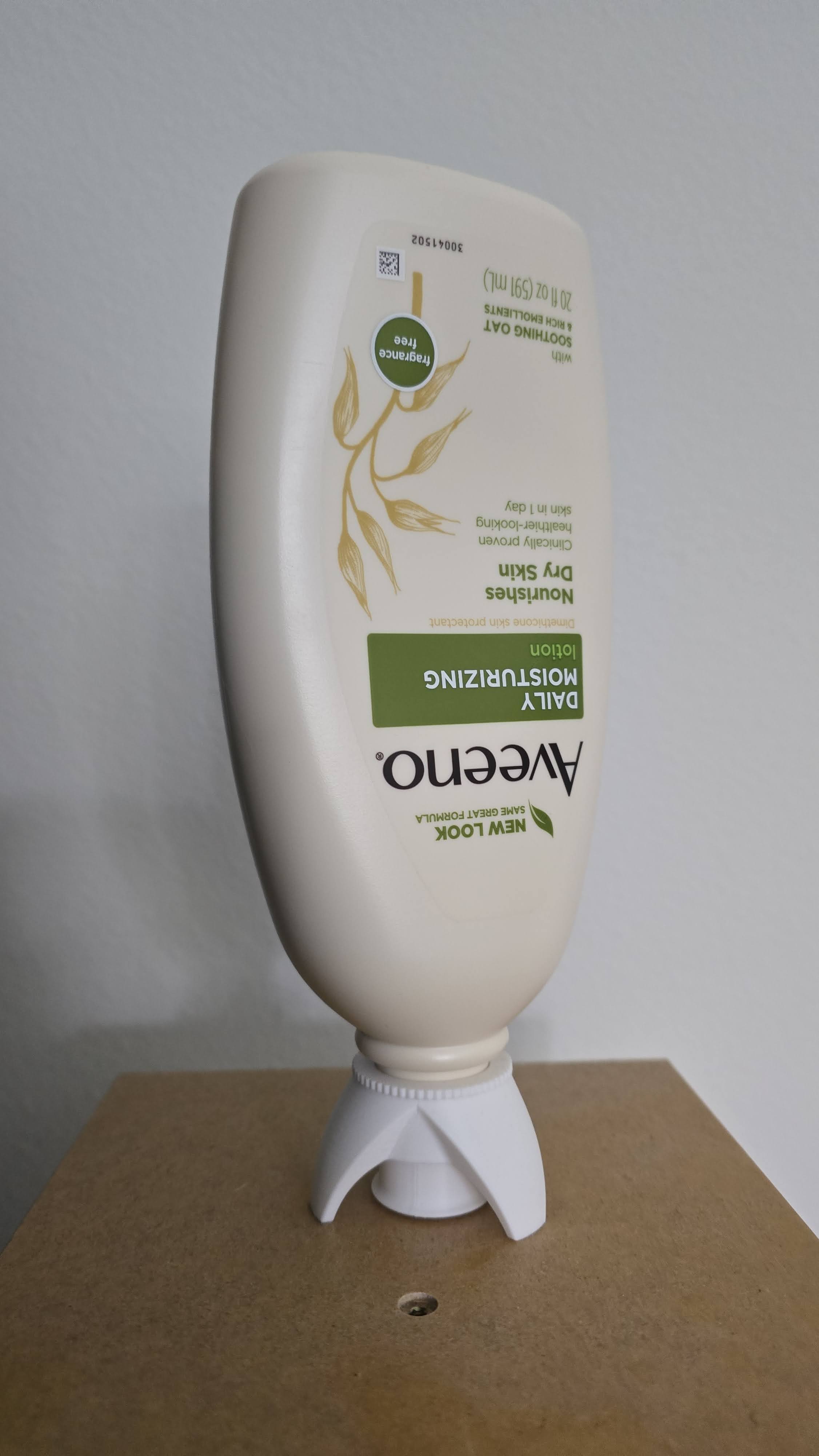 White ABS-printed bottle cap with flip nozzle, mounted on a lotion bottle