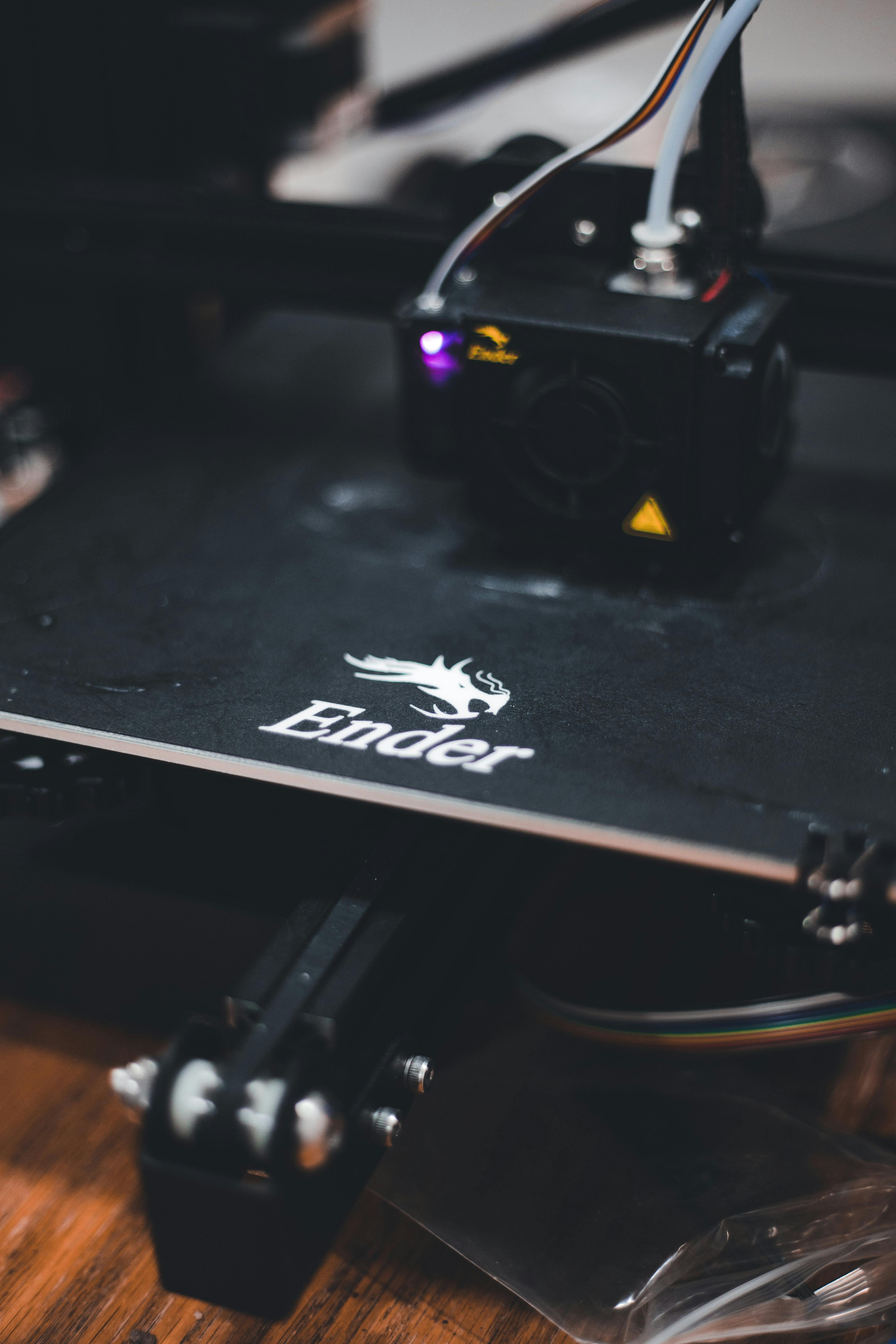 Close-up of 3D printer nozzle extruding filament